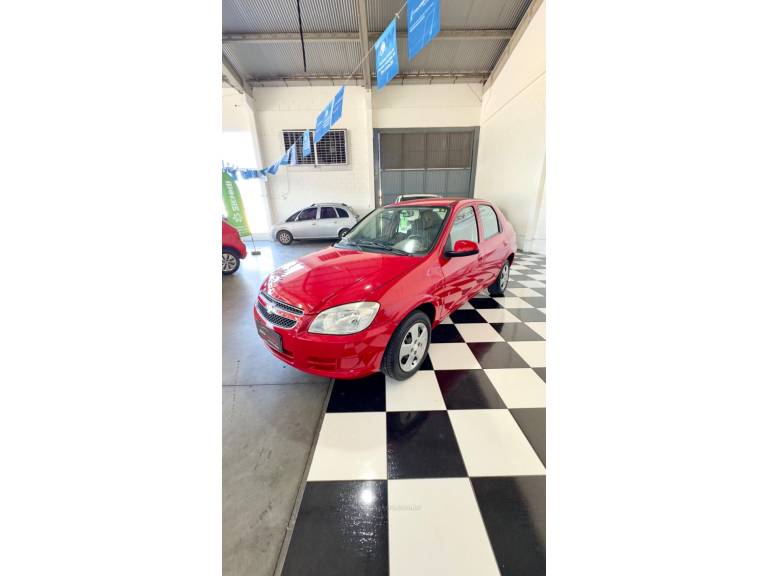 CHEVROLET - PRISMA - 2012/2012 - Vermelha - R$ 33.900,00