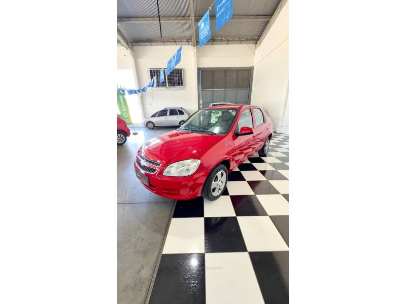 CHEVROLET - PRISMA - 2012/2012 - Vermelha - R$ 33.900,00